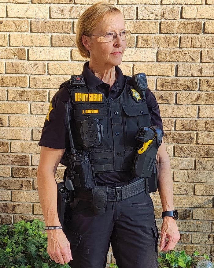 JoAnn in her deputy sheriff uniform after her transformation